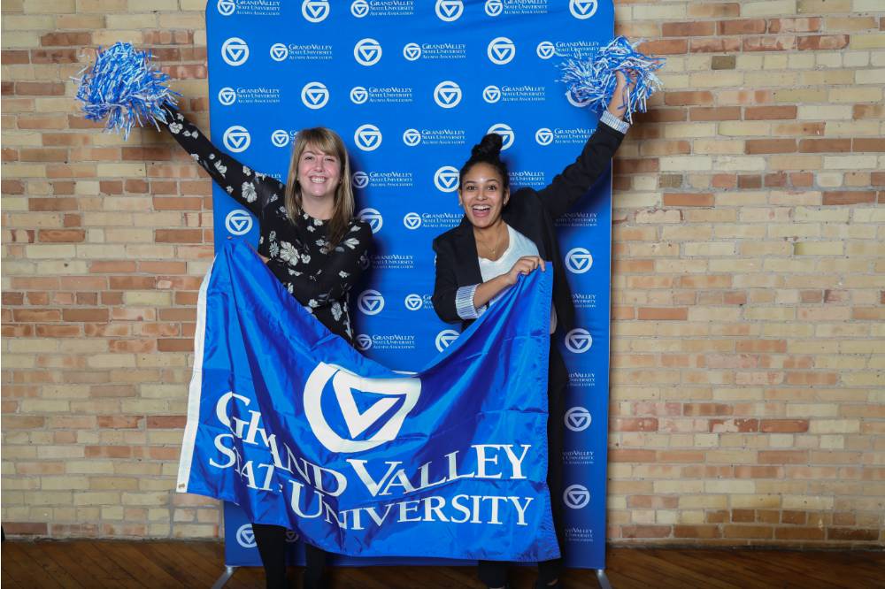 Lakers pose with GVSU banner